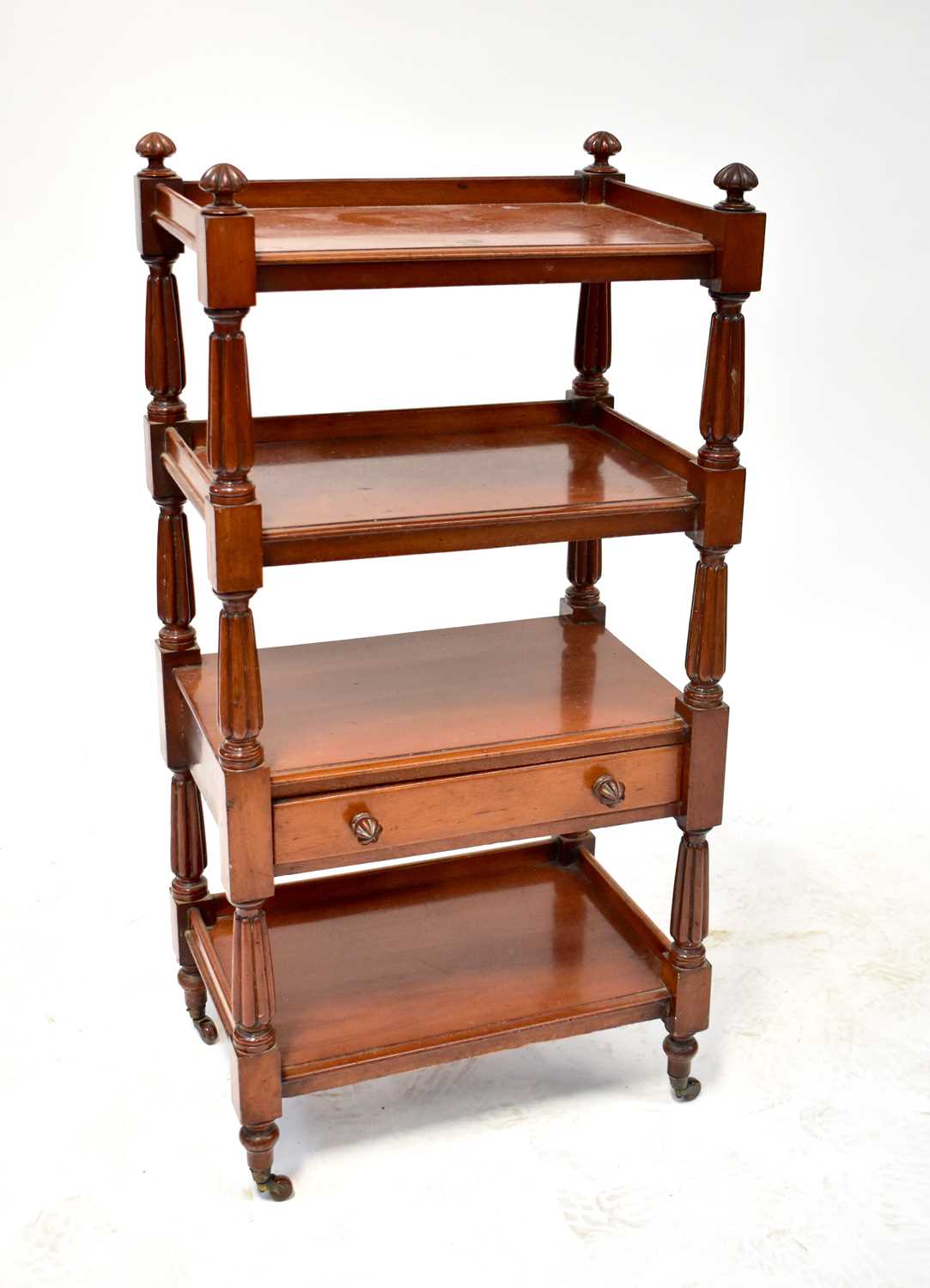 A 19th century mahogany whatnot with two shelves above a single drawer above a single shelf, with