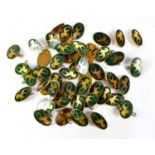 Fifty gilt metal and green enamel unicorn badges (50).Qty: 50