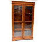 An Edwardian mahogany bookcase with two glazed doors and three interior shelves, 179 x 103 x 47cm.