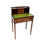 A reproduction mahogany bureau de dame/escritoire with upper three-drawer and four-pigeonhole