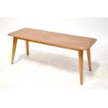 VANSON; a 1960s teak coffee table with shaped top above outswept tapering supports, 43 x 107 x