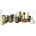 A group of late 19th/early 20th century mixed metalware to include pewter tankards and measuring