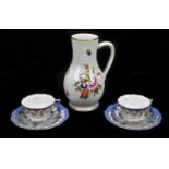 HEREND; two porcelain trios with hand painted floral decoration inside a cobalt blue border,