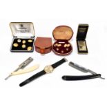 A cased set of gold plated cufflinks and shirt studs, a gentleman's Hourmaster wristwatch set with