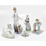 LLADRO; five assorted figures to include a nurse, height 38cm, a model of a swan, etc (5).Light wear