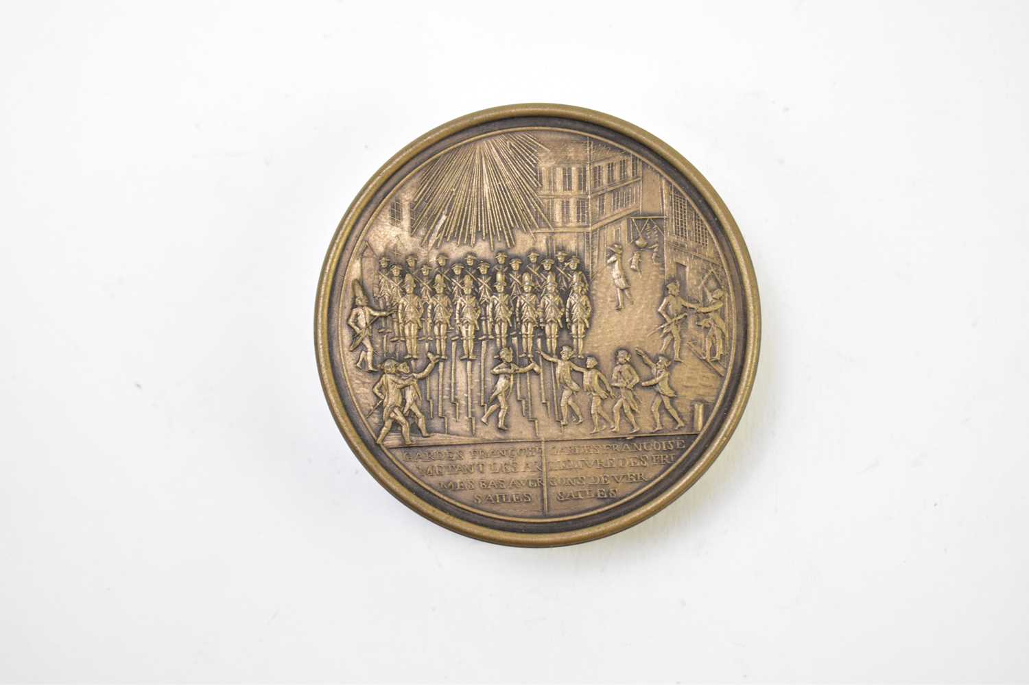 A 19th century French metal and lacquered snuff box of circular form depicting guards at Versailles, - Image 2 of 6