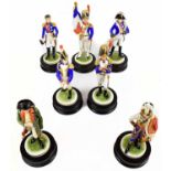 KAISER; a collection of seven porcelain soldier figures, on wooden plinth bases, average height 23cm