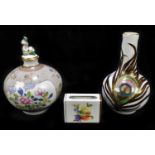 HEREND; three pieces of porcelain comprising a bulbous scent bottle with floral decoration, with