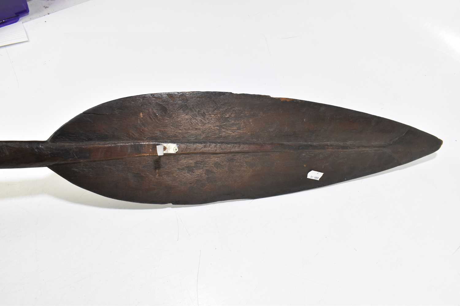 A late 19th/early 20th century hardwood tribal paddle with the detail of a stylised face to one side - Image 3 of 6
