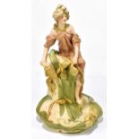 ROYAL DUX; an Art Nouveau posy vase representing a maiden resting on Art Nouveau style flowers,