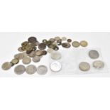 A small collection of assorted coinage and tokens, to include USA $1, commemorative crowns,