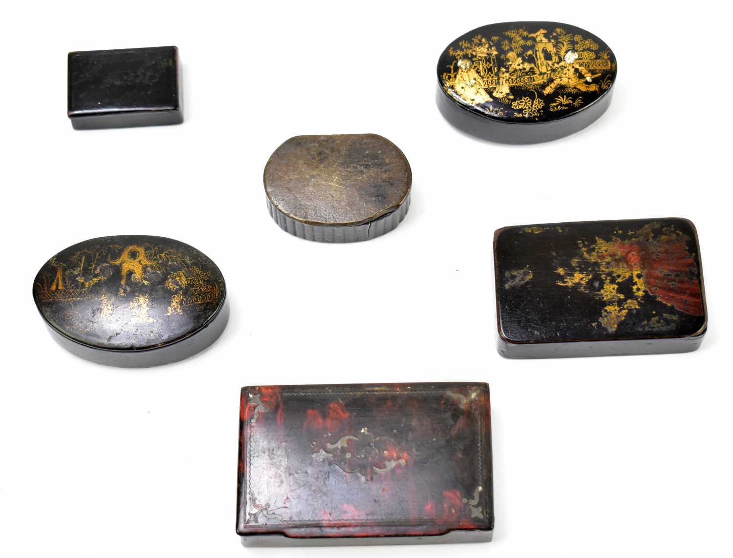 A collection of six 19th century and later papier-mâché and lacquered snuff boxes to include an