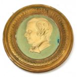 ROBERT BURNS; an unusual painted plaster oval plaque decorated in profile within an integral moulded