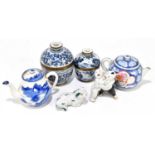 Two decorative modern Chinese blue and white and metal bound lidded jars, each bearing four