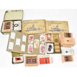 An early 20th century postcard album containing a quantity of postcards, various scenes and