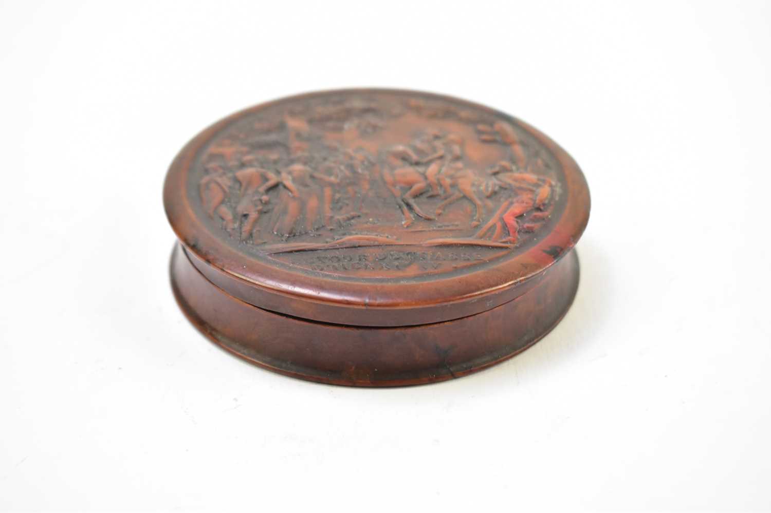 A 19th century French burr wood snuff box of circular form embossed with figures on horseback, - Image 4 of 5