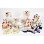 STAFFORDSHIRE; a collection of 19th century and later animal figures including a large pair of