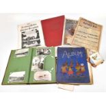 Two postcard albums containing a collection of assorted postcards, various subjects including