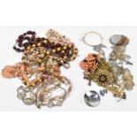 A collection of costume jewellery to include a Scottish hardstone brooch, assorted necklaces, etc.