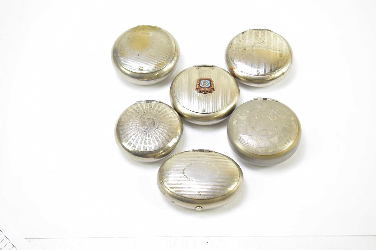 Six chrome and pewter circular and oval squeeze snuff boxes to include an example with applied - Image 2 of 4