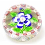 BACCARAT; a 19th century primrose garland paperweight, with star cut base, circa 1840, diameter