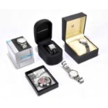 A collection of four gentleman's wristwatches comprising a Dunhill stainless steel wristwatch with