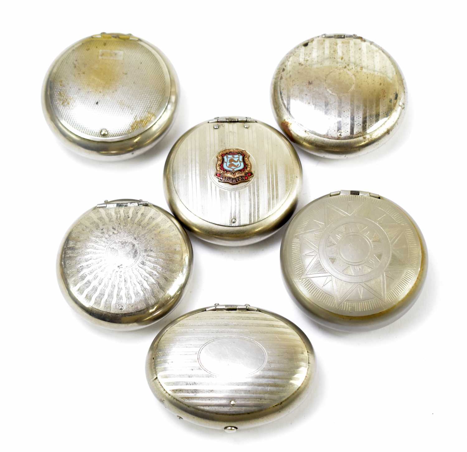 Six chrome and pewter circular and oval squeeze snuff boxes to include an example with applied