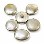 Six chrome and pewter circular and oval squeeze snuff boxes to include an example with applied