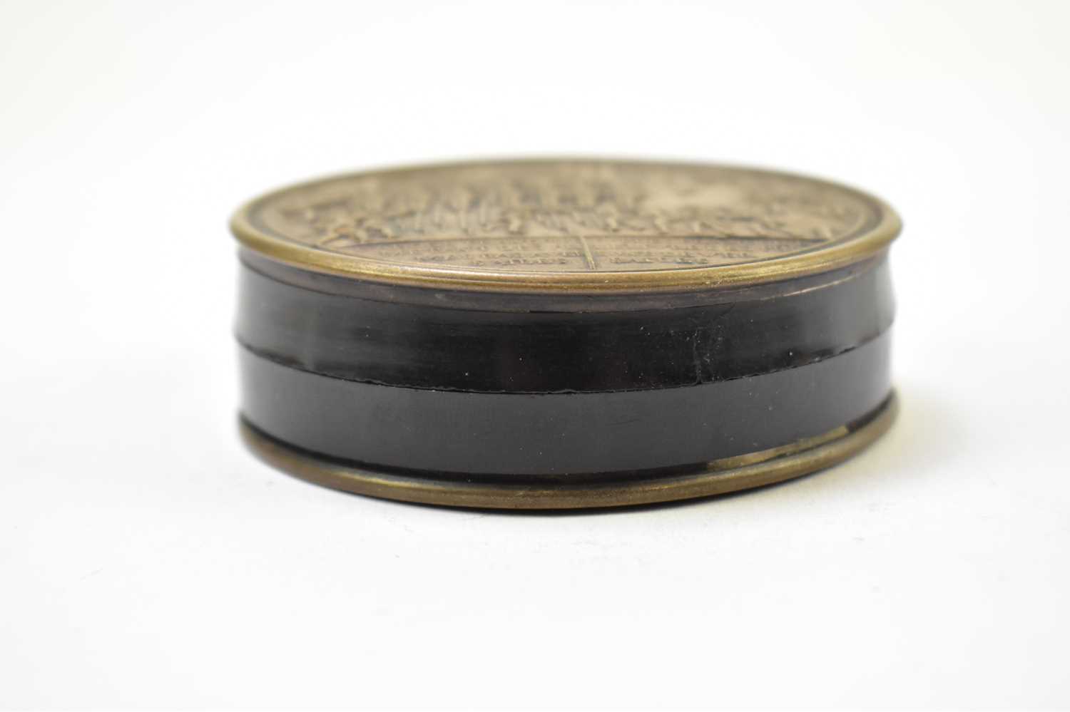 A 19th century French metal and lacquered snuff box of circular form depicting guards at Versailles, - Image 3 of 6