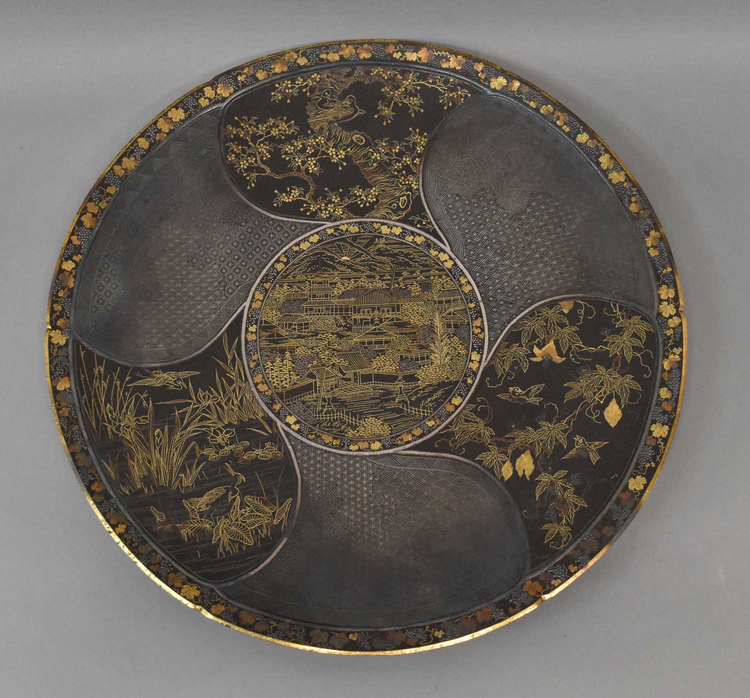 A good Japanese Meiji period mixed metal plate, finely detailed with a central landscape and three