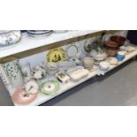 Three shelves of decorative and domestic ceramics including vases, huge meat plate, pottery, a