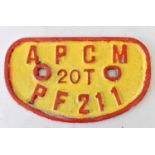 RAILWAYANA; wagon plate, APCM 20T PF211, red lettering on yellow background, 16.5 x 28.5cm.
