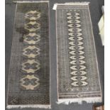 Two hand knotted woollen runners, the larger 183 x 61cm.
