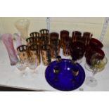 A mixed lot of predominantly coloured glassware including set of eight green and gilt tumblers, a