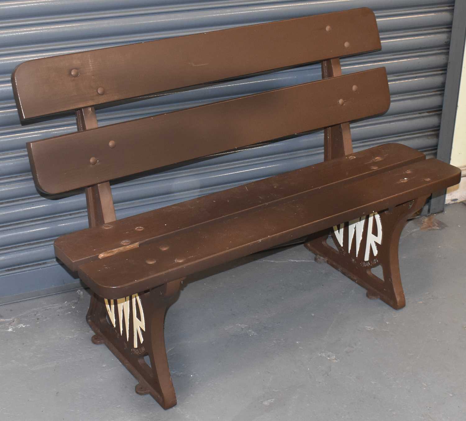 RAILWAYANA; a GWR platform bench with cast iron base and wooden seat, length 120cm.