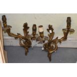 A pair of gilt metal Rococo style two branch wall lights, height 33cm.