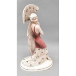 HERTWIG KATZHUTTE; an Art Deco ceramic figure of a young woman holding a fan aloft, printed marks to