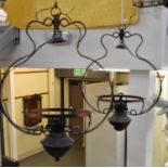A pair of early 20th century ceiling lights with opaque shades.
