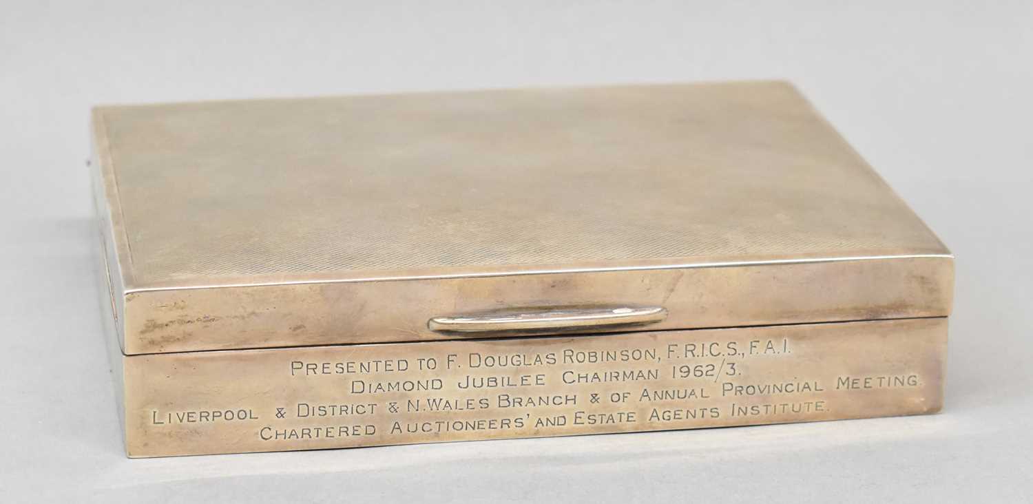 WALKER & HALL; a large hallmarked silver cigarette box with presentation inscription, Sheffield