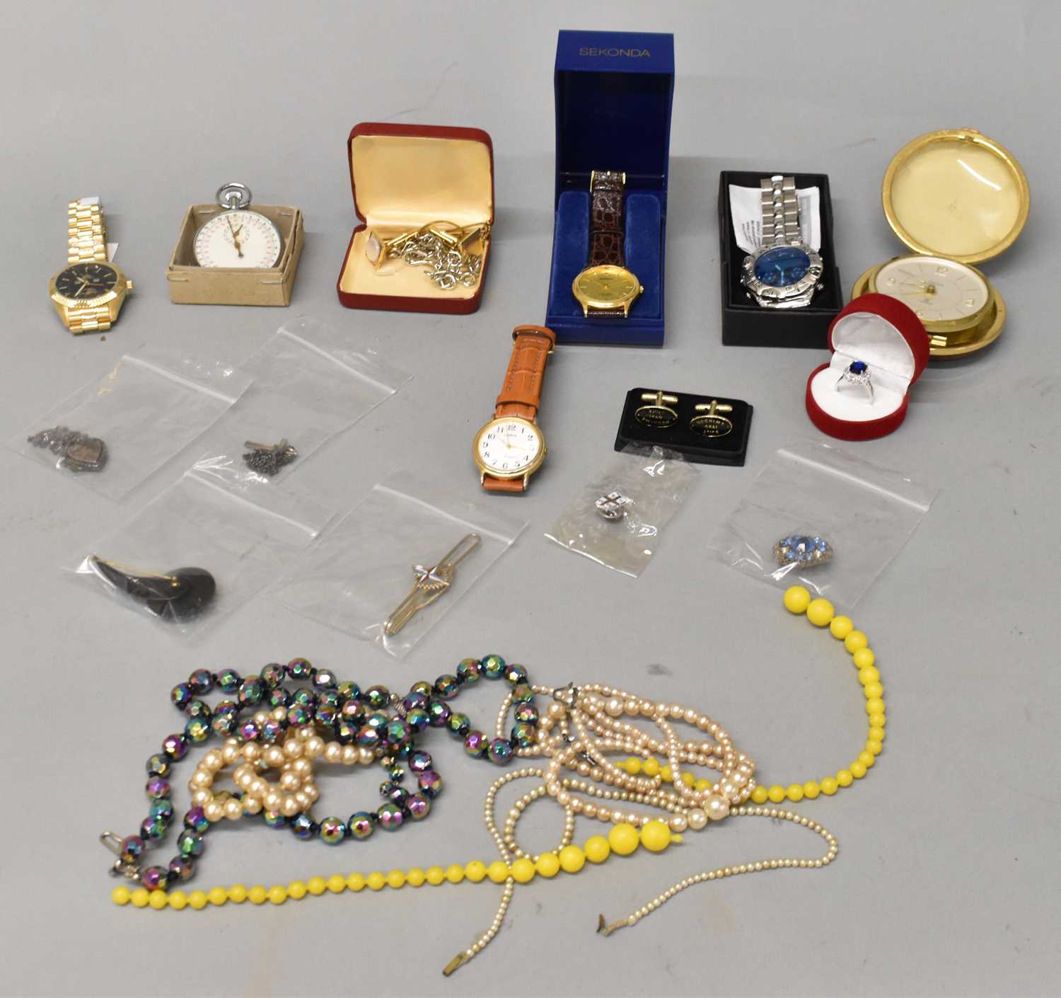 A mixed lot including stopwatch, four modern gent's watches, alarm clock, and a small quantity of