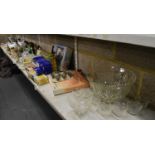 Four shelves of assorted items including a Murano swan dish, a silver plated drinks tray, two