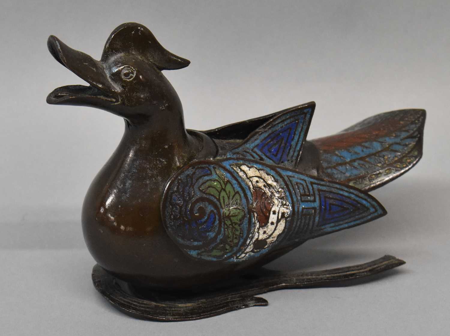 An 18th/19th century Chinese bronze and champleve enamel decorated incense burner modelled as a