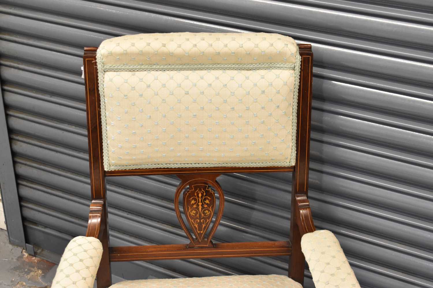 An Edwardian inlaid mahogany upholstered open armchair on ring turned supports. - Image 2 of 2