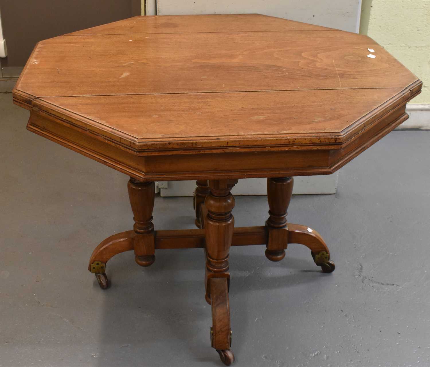 A late 19th century walnut Gothic Revival centre table in the style of Pugin, with octagonal top