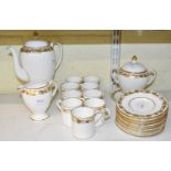 A Wedgwood 'Whitehall' part coffee service comprising nine cups, coffee pot, thirteen saucers, sugar