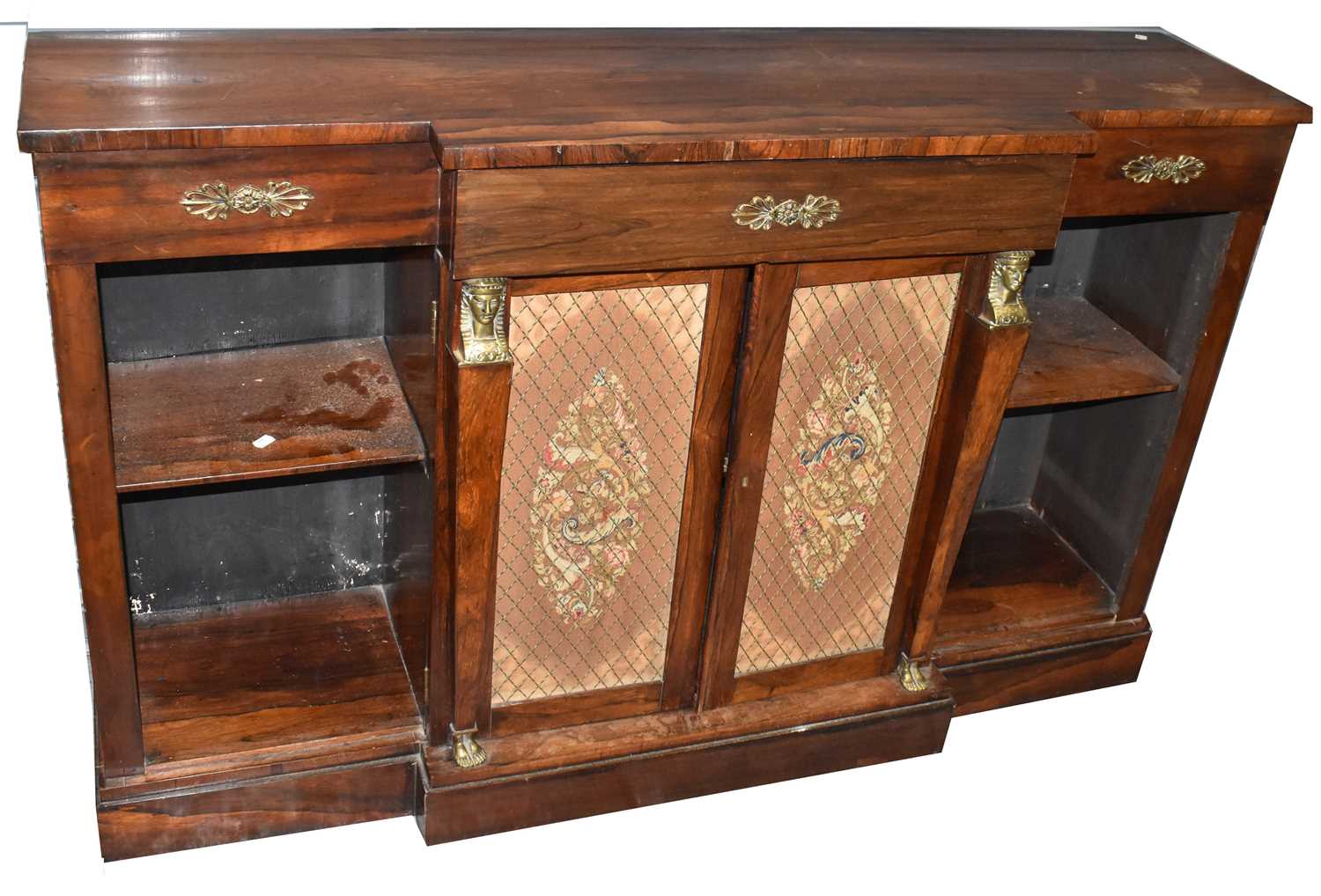 An early 19th century Regency period rosewood breakfront credenza with Egyptian style gilt metal