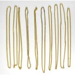 Ten large gold plated necklaces.Qty: 10