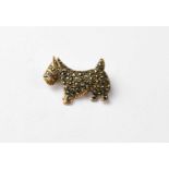 A vintage yellow metal brooch in the form of a Scottie dog clad in marcasite.Length 2.