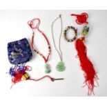 A quantity of Oriental jewellery to include two jadeite necklaces, a bracelet, etc.