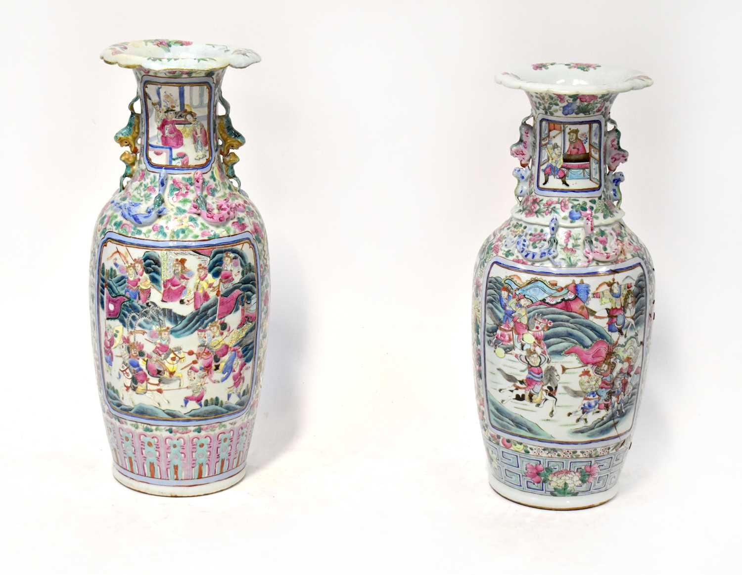 A pair of 19th century Chinese Famille Rose vases of baluster form, each painted with vignettes of